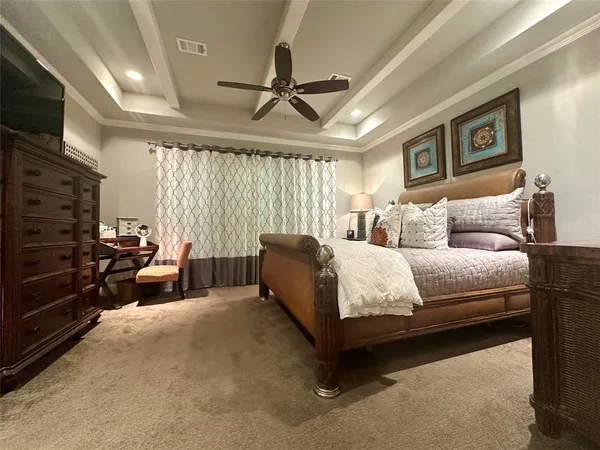a living room with furniture ceiling fan and a window