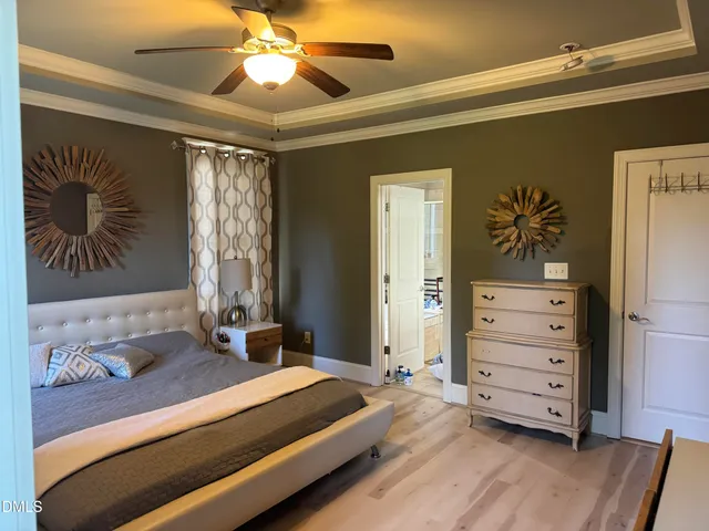 a living room with furniture wooden floor and a flat screen tv