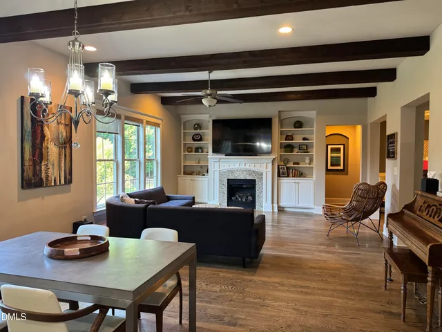 a living room with furniture fireplace and a flat screen tv