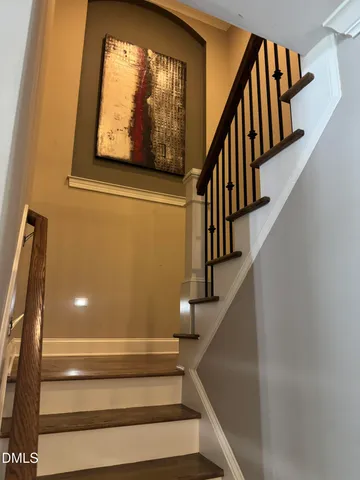 a kitchen with stainless steel appliances kitchen island granite countertop a sink and cabinets