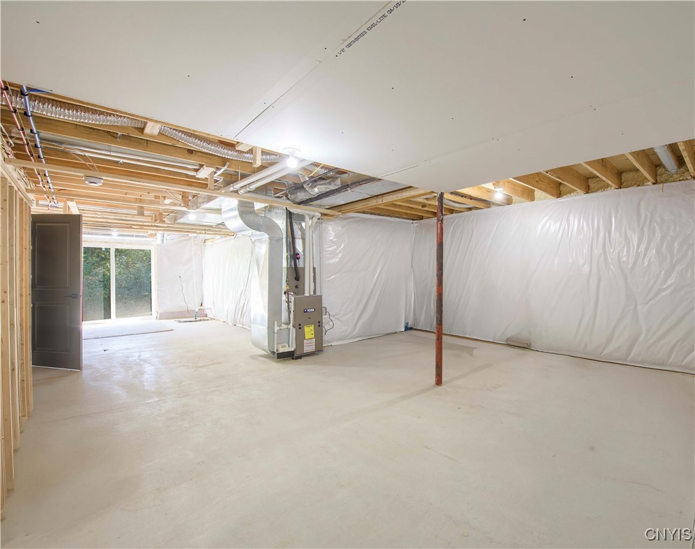 4792 Countryside Drive Onondaga, NY 13215 - Photo 37 of 42 Unfinished Basement - sliding door exit to yard