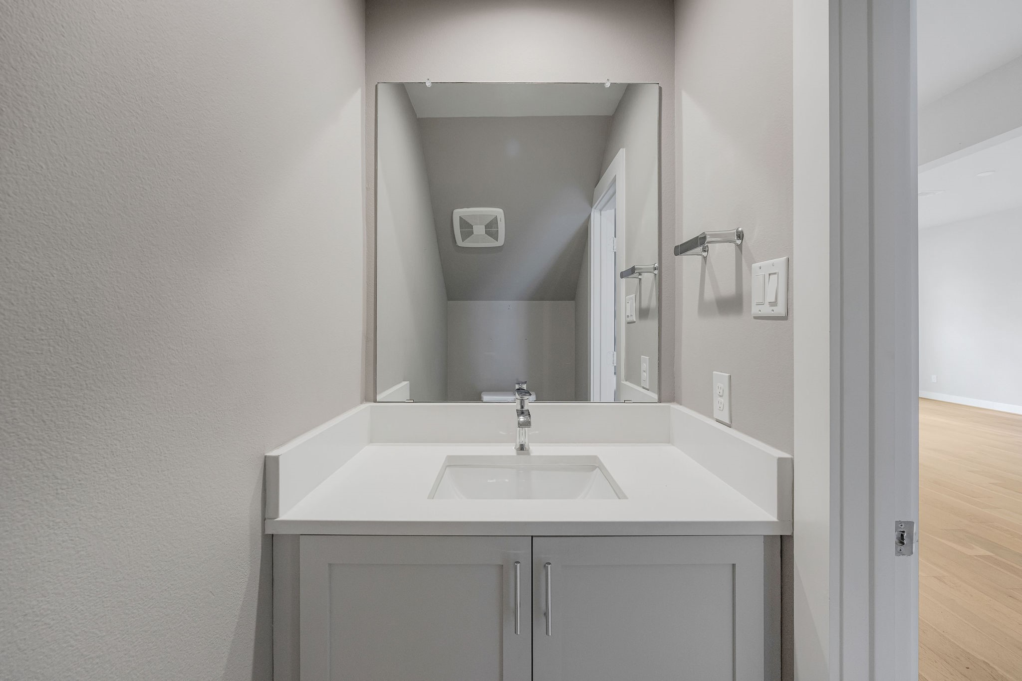 540 Janisch Road, Unit A Houston, TX 77018 - Photo 11 of 18 Clean and modern powder bathroom featuring a sleek vanity, quartz countertop, and modern finishes.