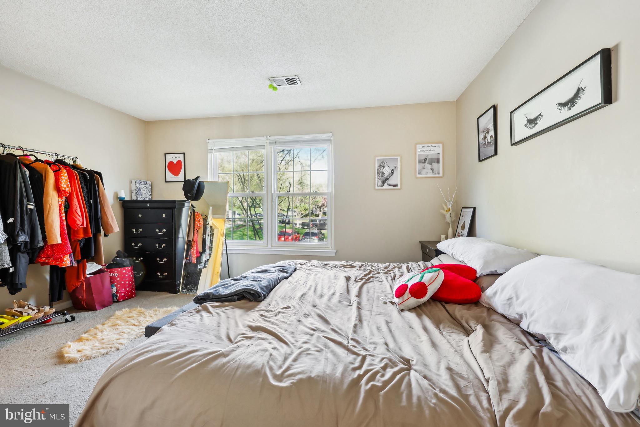 3805 Green Ridge Court, Unit 201 Fairfax, VA 22033 - Photo 15 of 25 a bedroom with a bed and a window