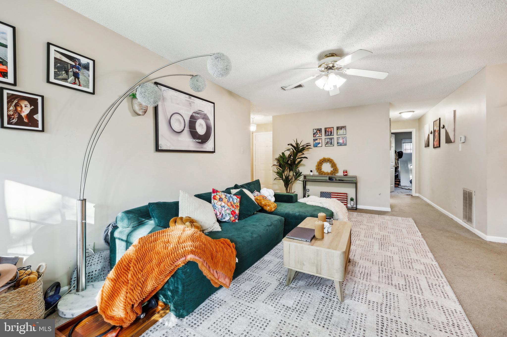 3805 Green Ridge Court, Unit 201 Fairfax, VA 22033 - Photo 6 of 25 a living room with furniture and a chandelier