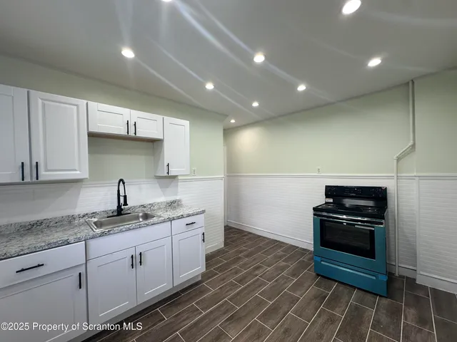 a bathroom with a sink and toilet