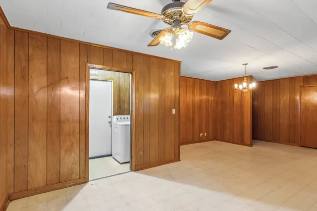 a view of a livingroom with a chandelier fan