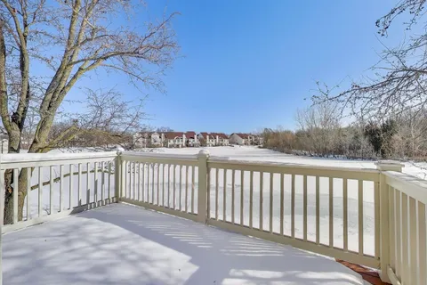 a view of a balcony with wooden fence
