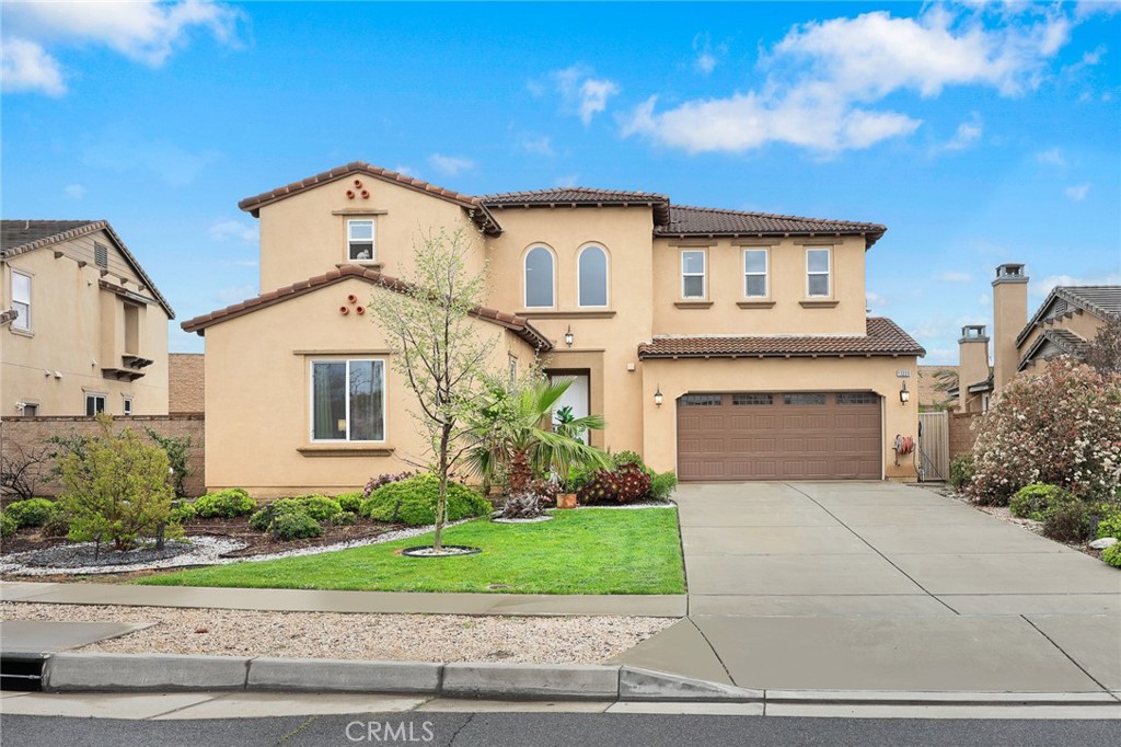 13229 Lima Drive Rancho Cucamonga, CA 91739 - Photo 1 of 1 a front view of a house with a yard and garage