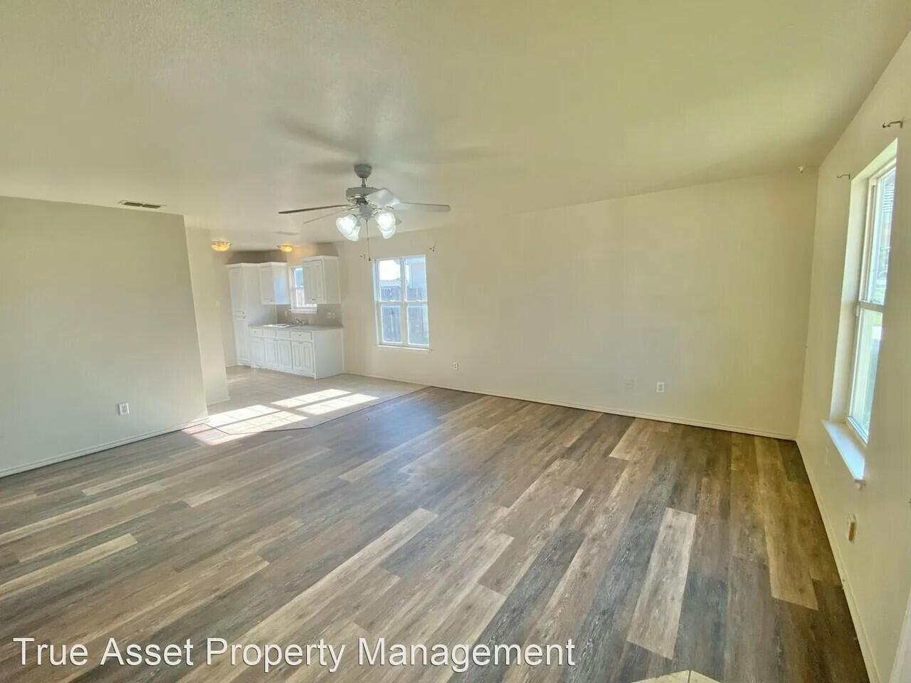 3508 East Colgate Street Lubbock, TX 79403 - Photo 15 of 38 wooden floor in an empty room with a window