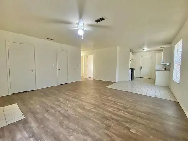 a kitchen with stainless steel appliances a sink stove and cabinets