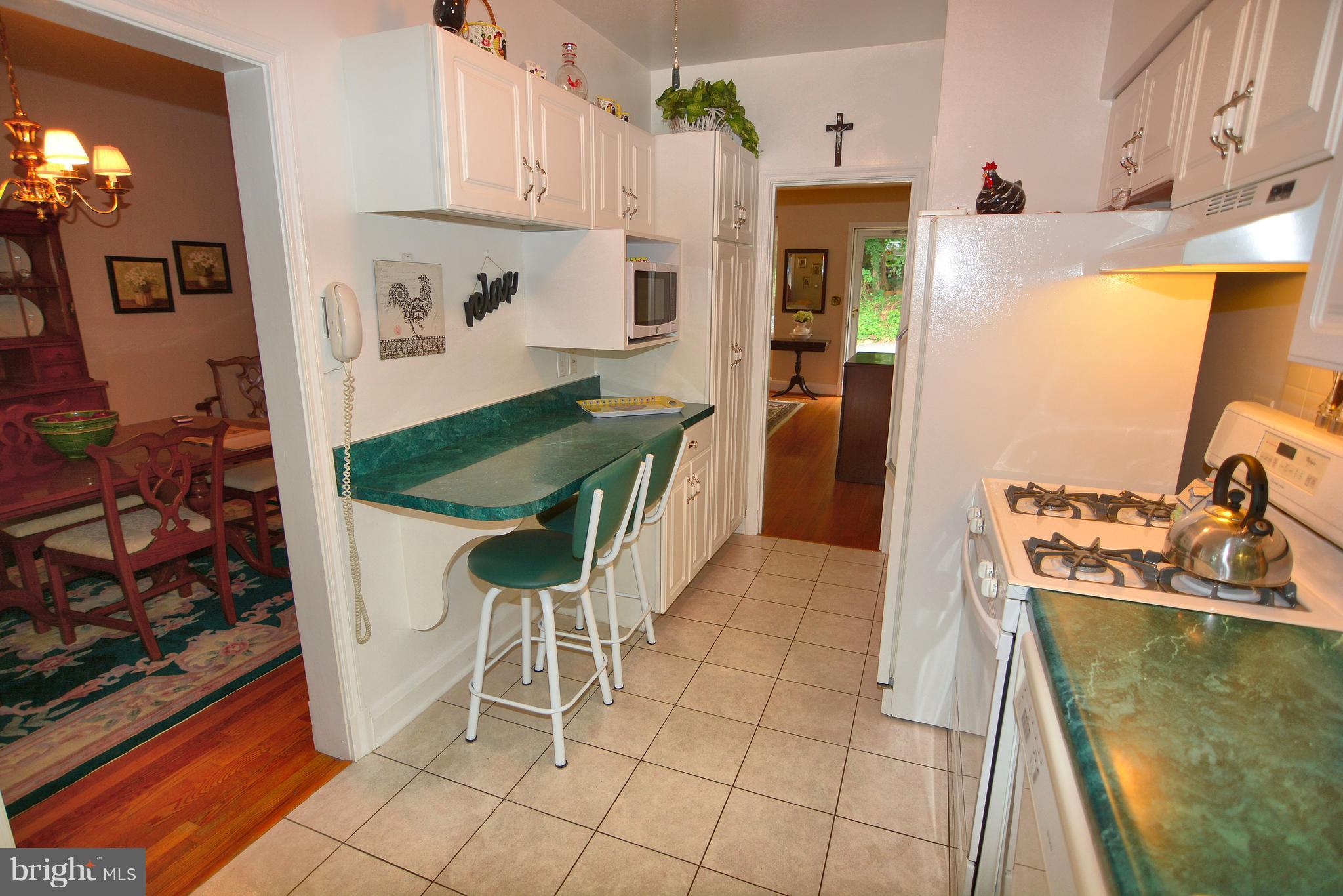 39 North Belle Grove Road Baltimore, MD 21228 - Photo 5 of 20 Kit boasts ceramic tile & breakfast bar