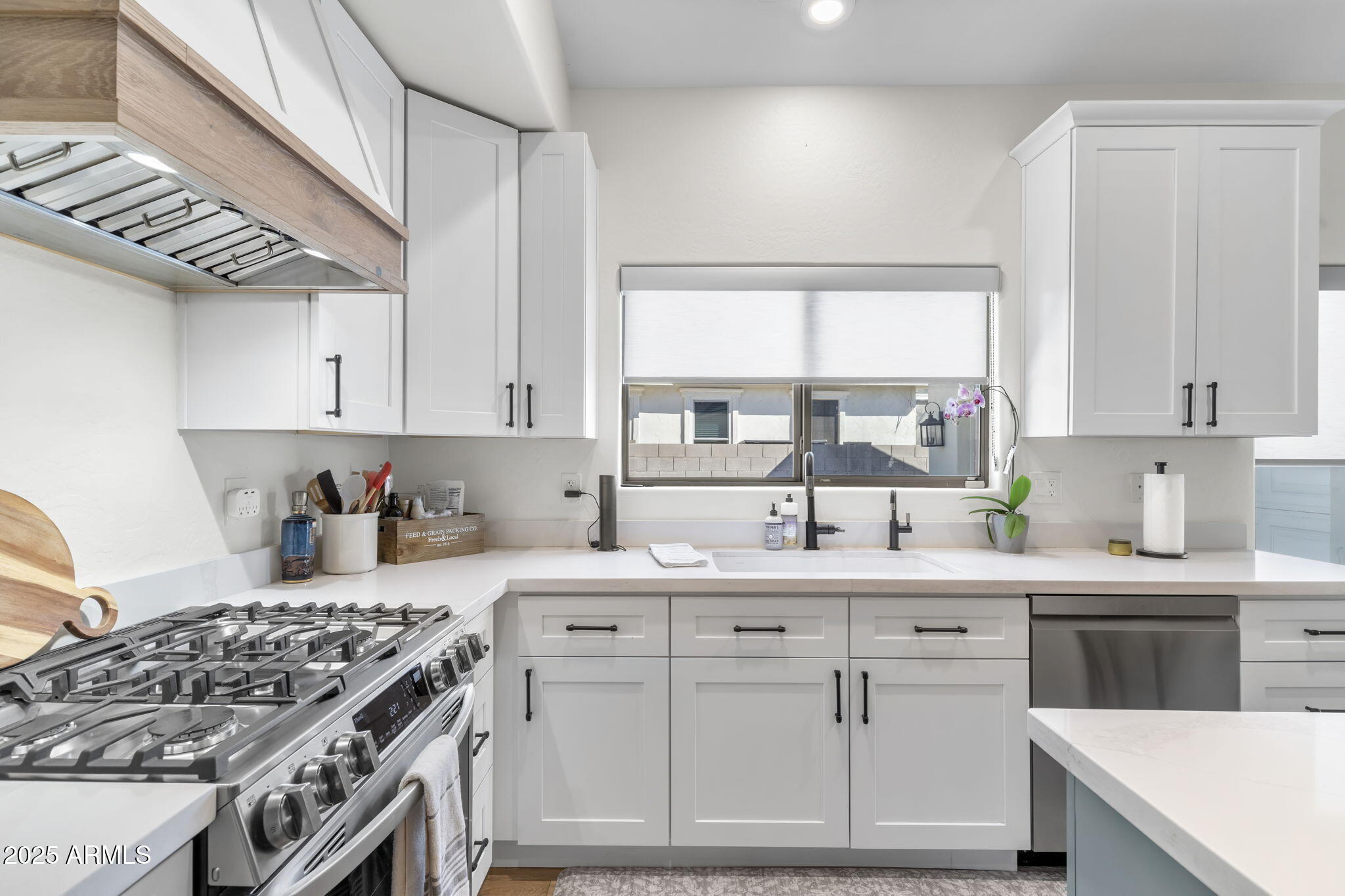 1123 East Fern Drive South, Unit SOUTH Phoenix, AZ 85014 - Photo 11 of 32 a kitchen with a sink stove and cabinets