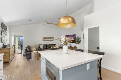 a view of a dining table chairs and chandelier