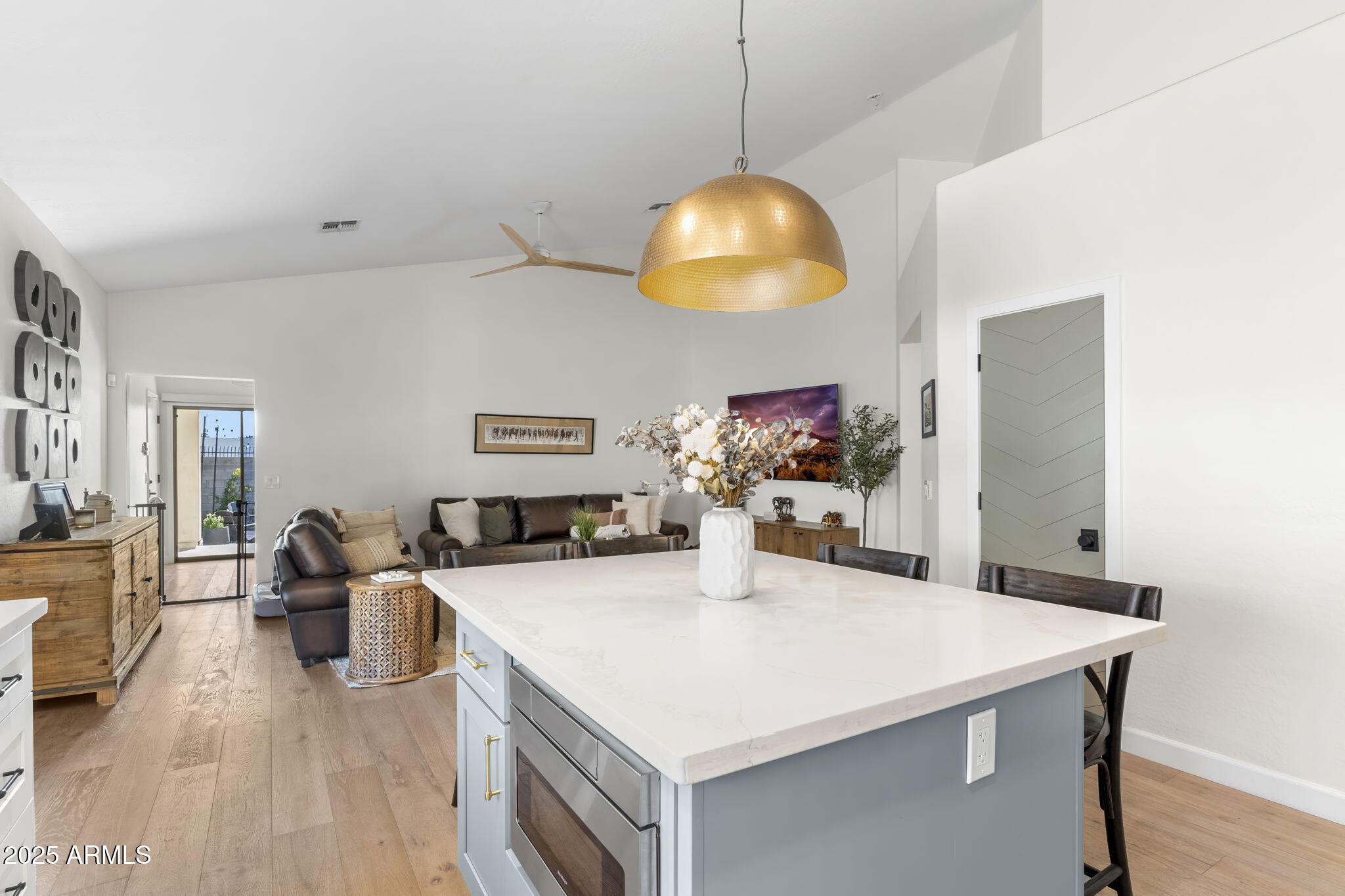 1123 East Fern Drive South, Unit SOUTH Phoenix, AZ 85014 - Photo 13 of 32 a view of a dining table chairs and chandelier