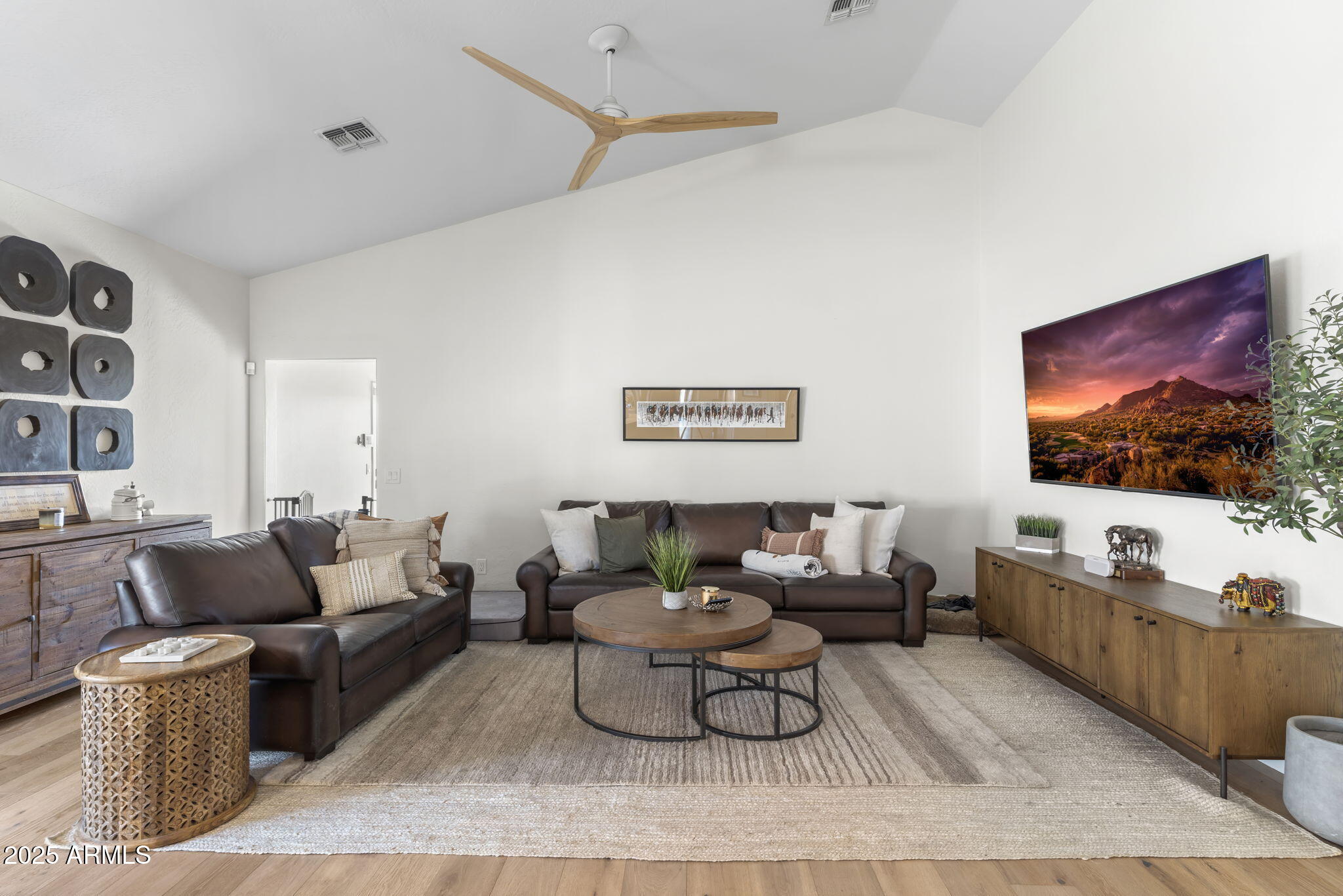 1123 East Fern Drive South, Unit SOUTH Phoenix, AZ 85014 - Photo 14 of 32 a living room with furniture and a flat screen tv
