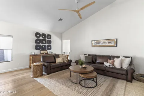 a living room with furniture and a rug
