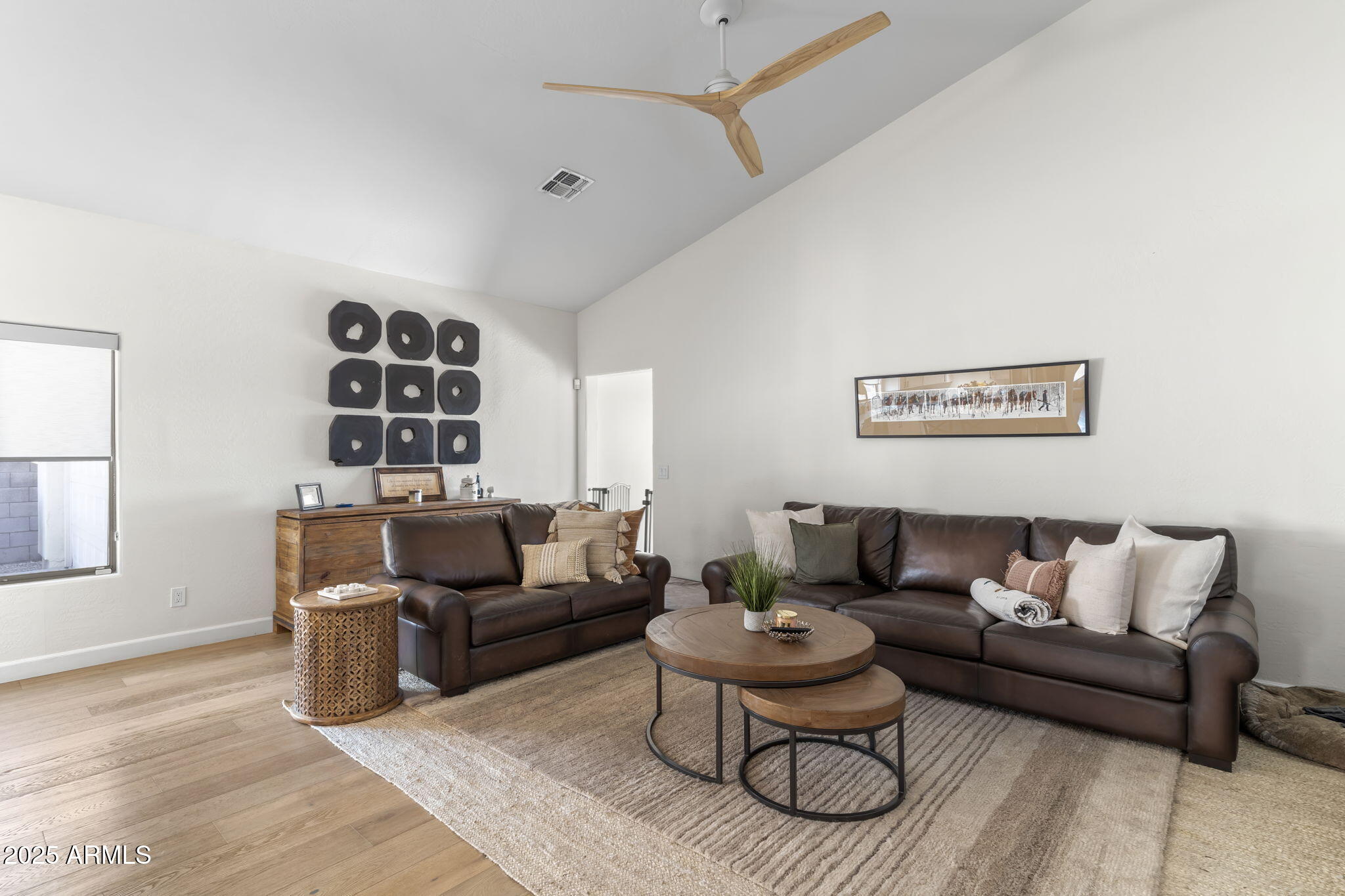 1123 East Fern Drive South, Unit SOUTH Phoenix, AZ 85014 - Photo 15 of 32 a living room with furniture and a rug