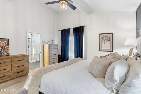 a bed room with a bed and a dresser