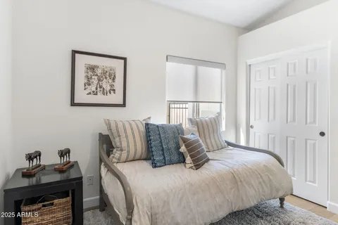 a bedroom with a bed and a window