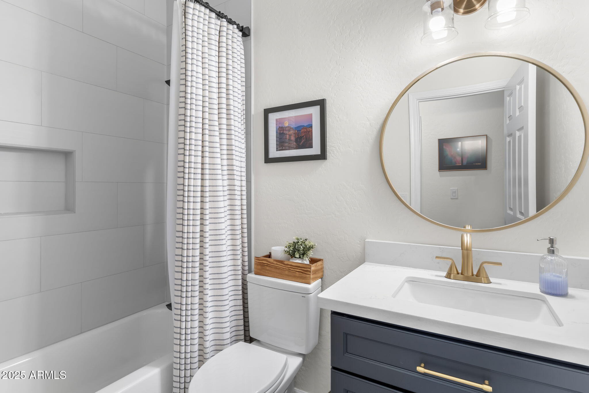 1123 East Fern Drive South, Unit SOUTH Phoenix, AZ 85014 - Photo 24 of 32 a bathroom with a sink mirror vanity and toilet