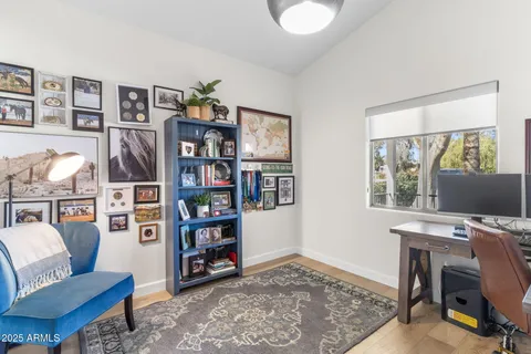 a view of a livingroom with workspace and a couch