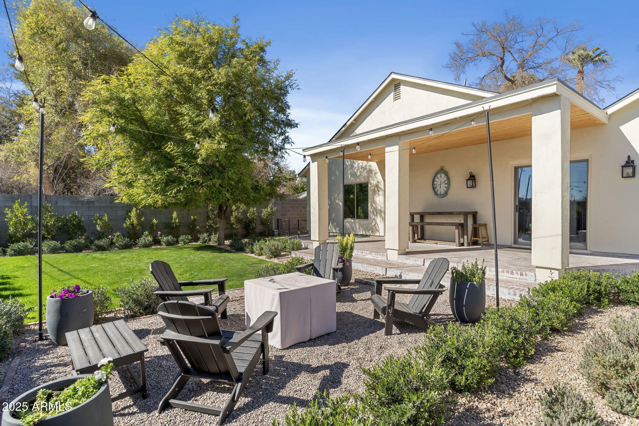 1123 East Fern Drive South, Unit SOUTH Phoenix, AZ 85014 - Photo 28 of 32 a view of a patio with chairs and a small yard