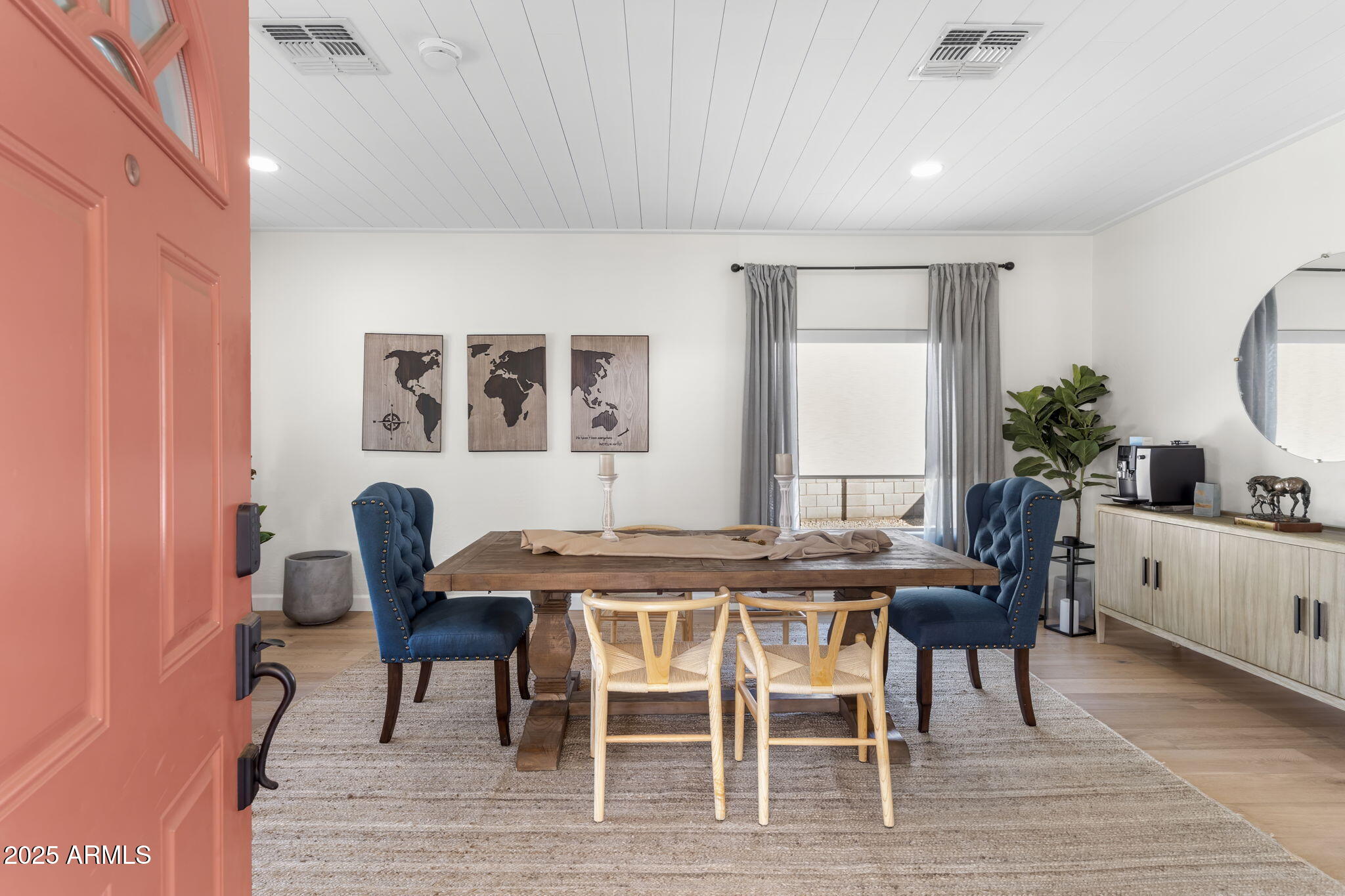 1123 East Fern Drive South, Unit SOUTH Phoenix, AZ 85014 - Photo 5 of 32 a view of a dining room with furniture and wooden floor