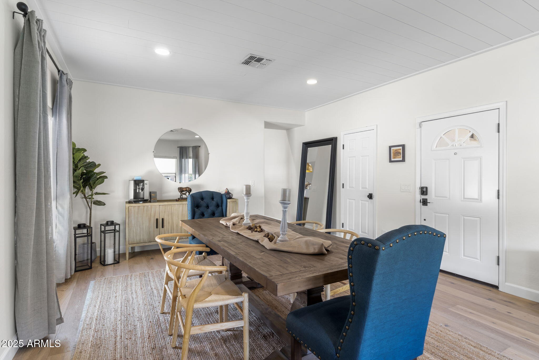1123 East Fern Drive South, Unit SOUTH Phoenix, AZ 85014 - Photo 6 of 32 a view of a dining room with furniture and wooden floor
