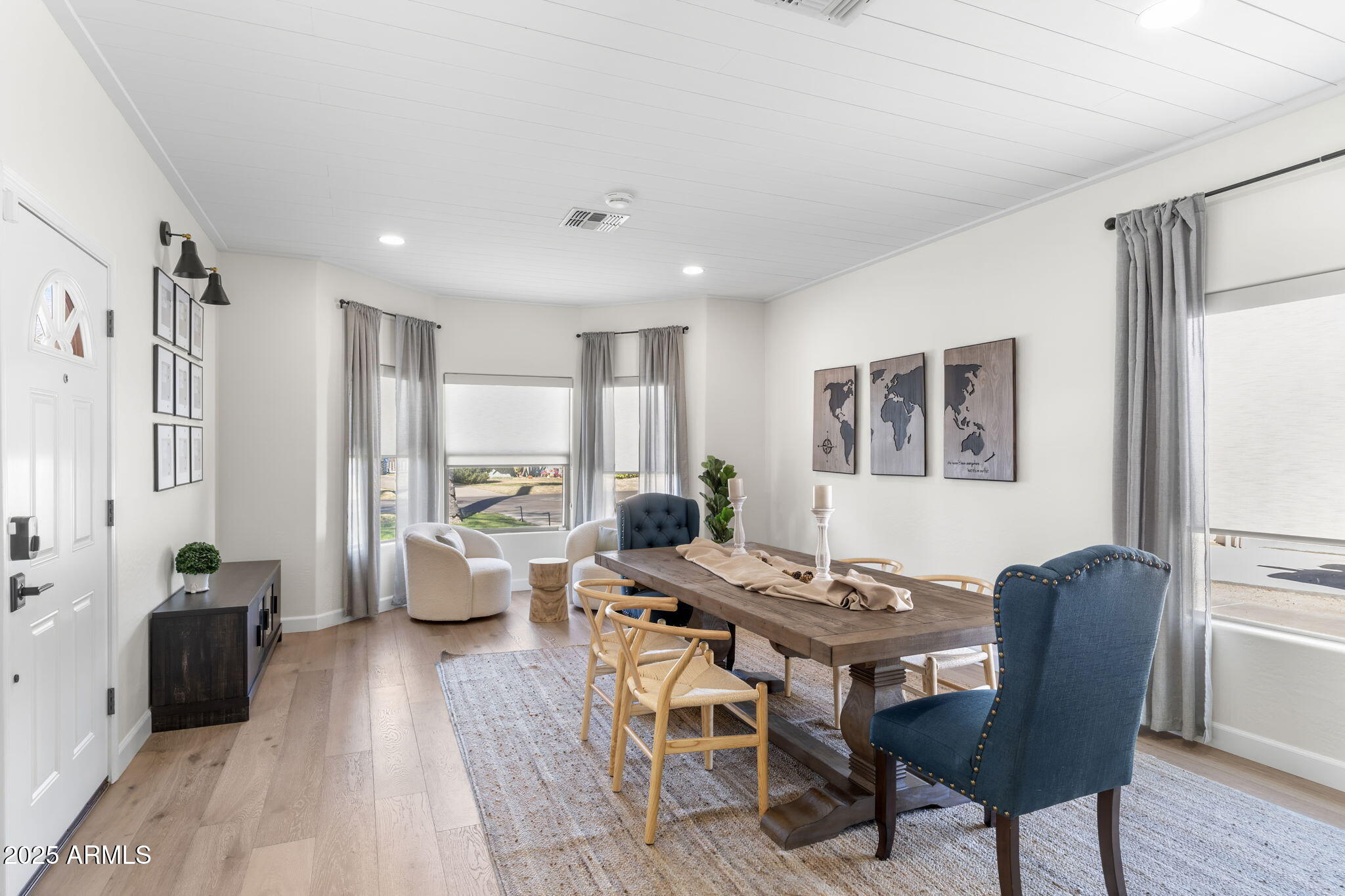 1123 East Fern Drive South, Unit SOUTH Phoenix, AZ 85014 - Photo 7 of 32 a view of a dining room with furniture window and wooden floor