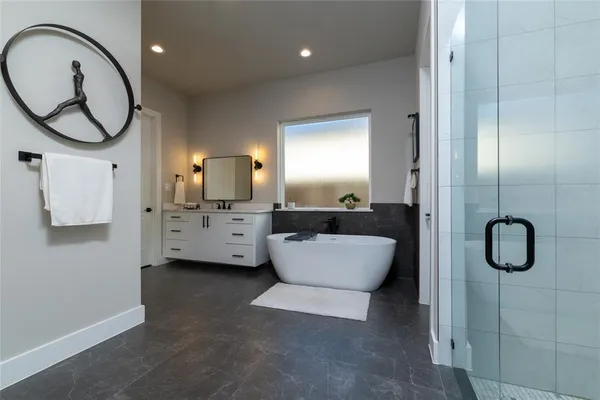 a bathroom with a toilet sink and tub