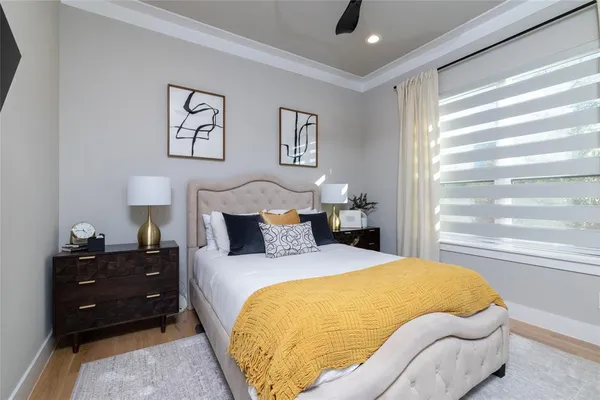 a bed room with a bed and a window