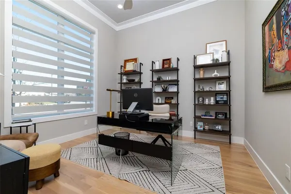 a reading room with furniture and a book shelf