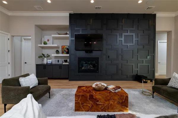 a bedroom with furniture and a fireplace