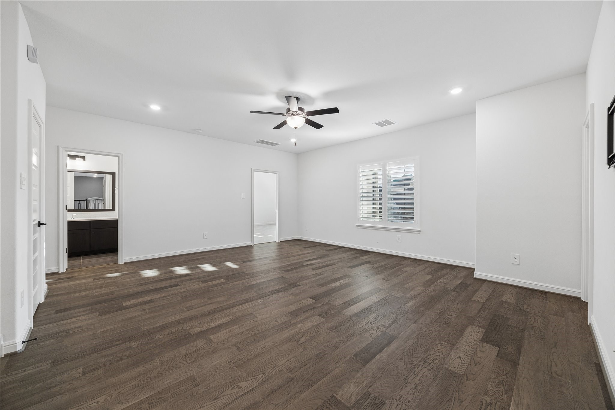 28015 Royal Swan Lane Spring, TX 77386 - Photo 19 of 25 Spacious upstairs living area that can serve as an additional family room or game room, offering a flexible layout ideal for relaxing or entertaining.