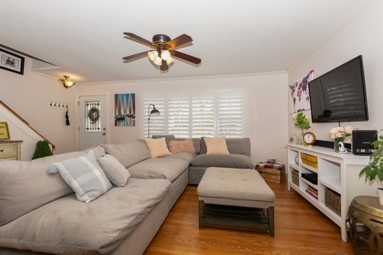 10906 Parkside Avenue Chicago Ridge, IL 60415 - Photo 2 of 15 a living room with furniture and a flat screen tv