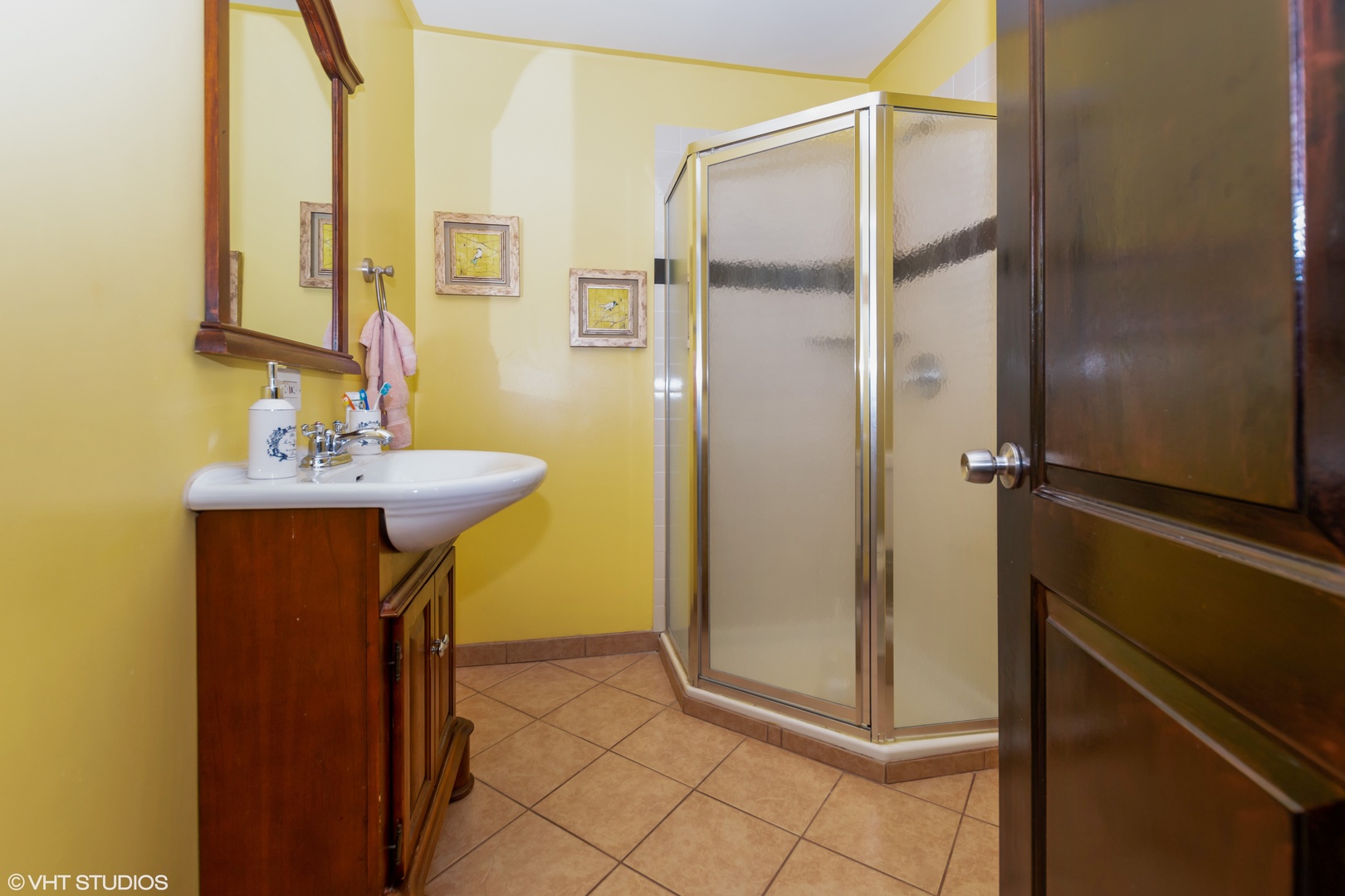 10906 Parkside Avenue Chicago Ridge, IL 60415 - Photo 6 of 15 a bathroom with a sink a mirror and a shower