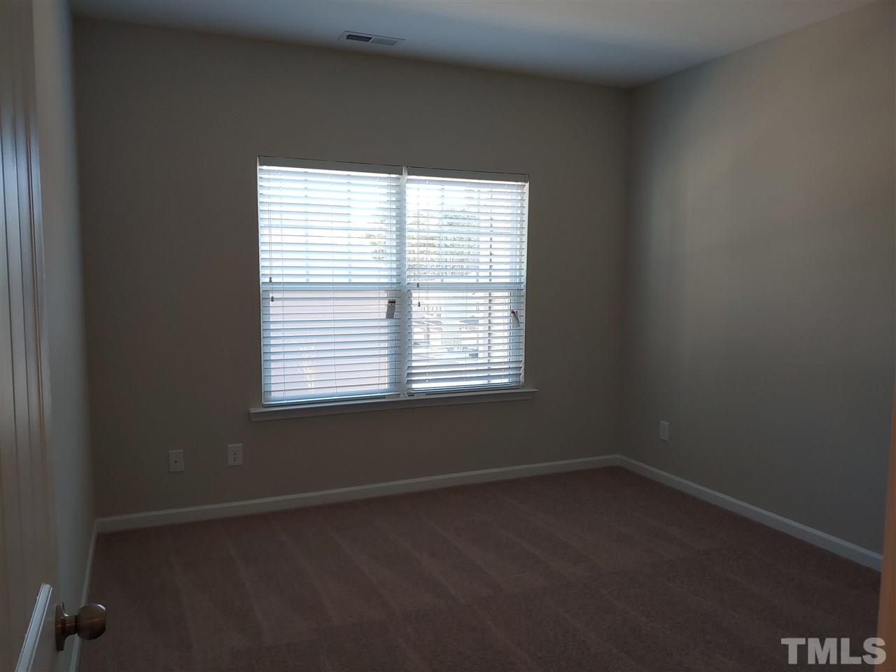 1204 Wingstem Place, Unit 2 Raleigh, NC 27607 - Photo 14 of 23 an empty room with a window