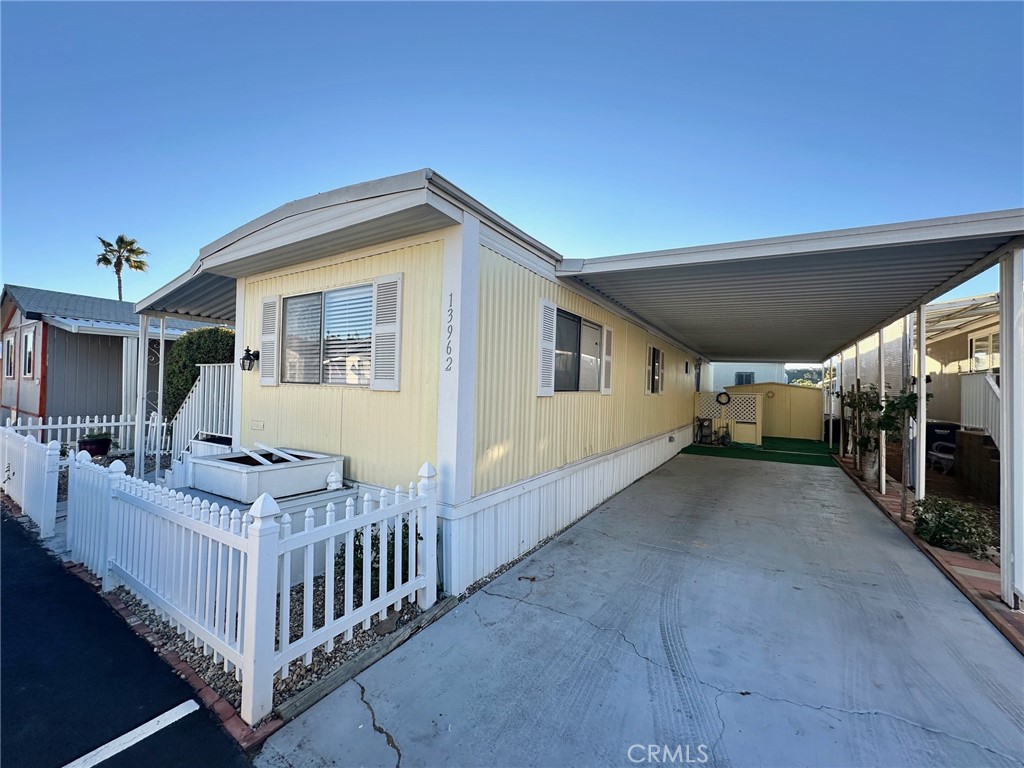 13962 Magnolia Avenue, Unit 90 Poway, CA 92064 - Photo 1 of 1 a view of livingroom with patio