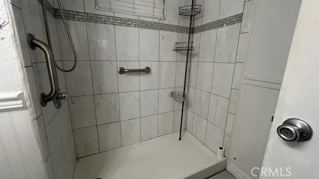 a view of a room with wooden floor and windows