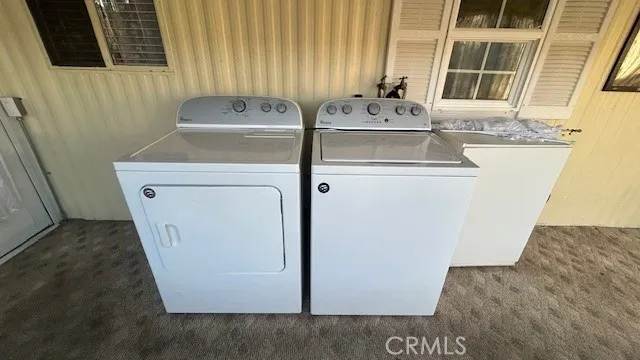 a view of a backyard with sitting area