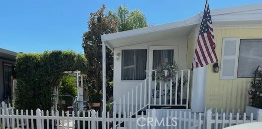 a view of a house with a small yard