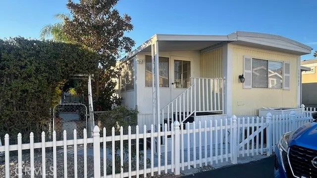 a view of a house with a small yard