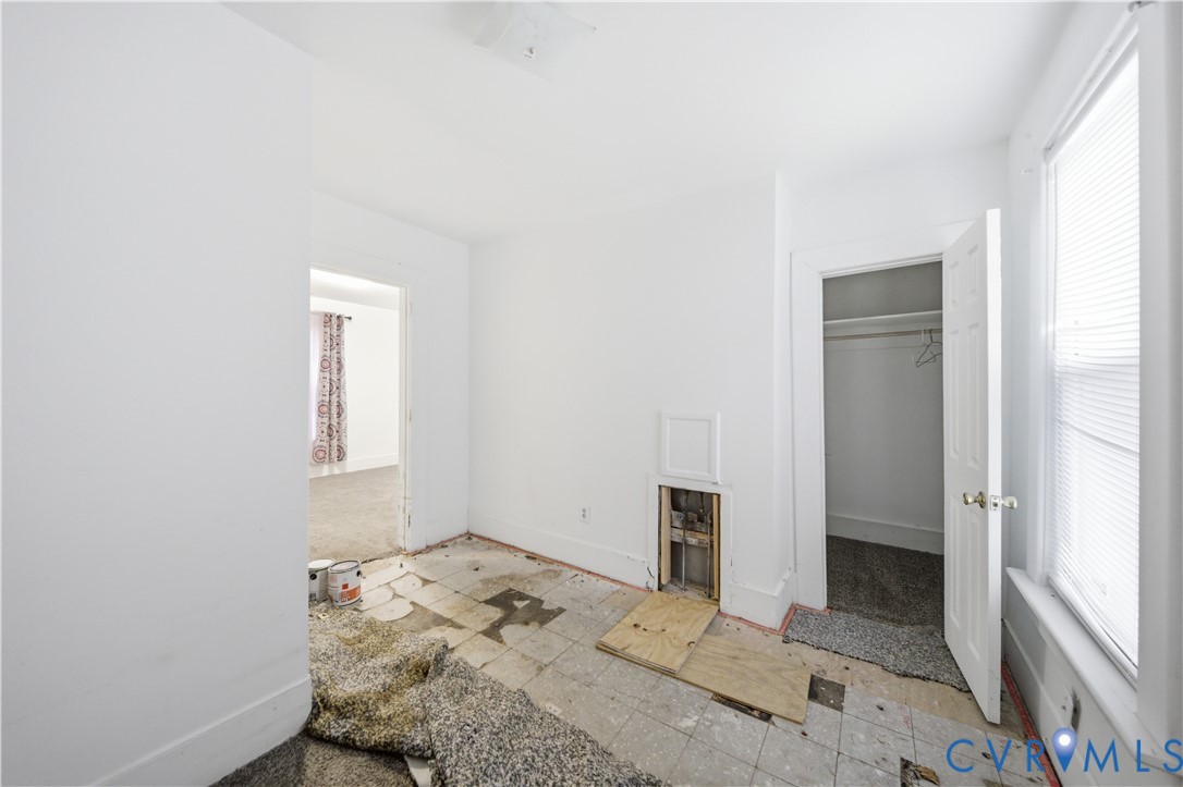 27 Bacon Street Hampton, VA 23669 - Photo 16 of 18 Unfurnished bedroom with a walk in closet and base