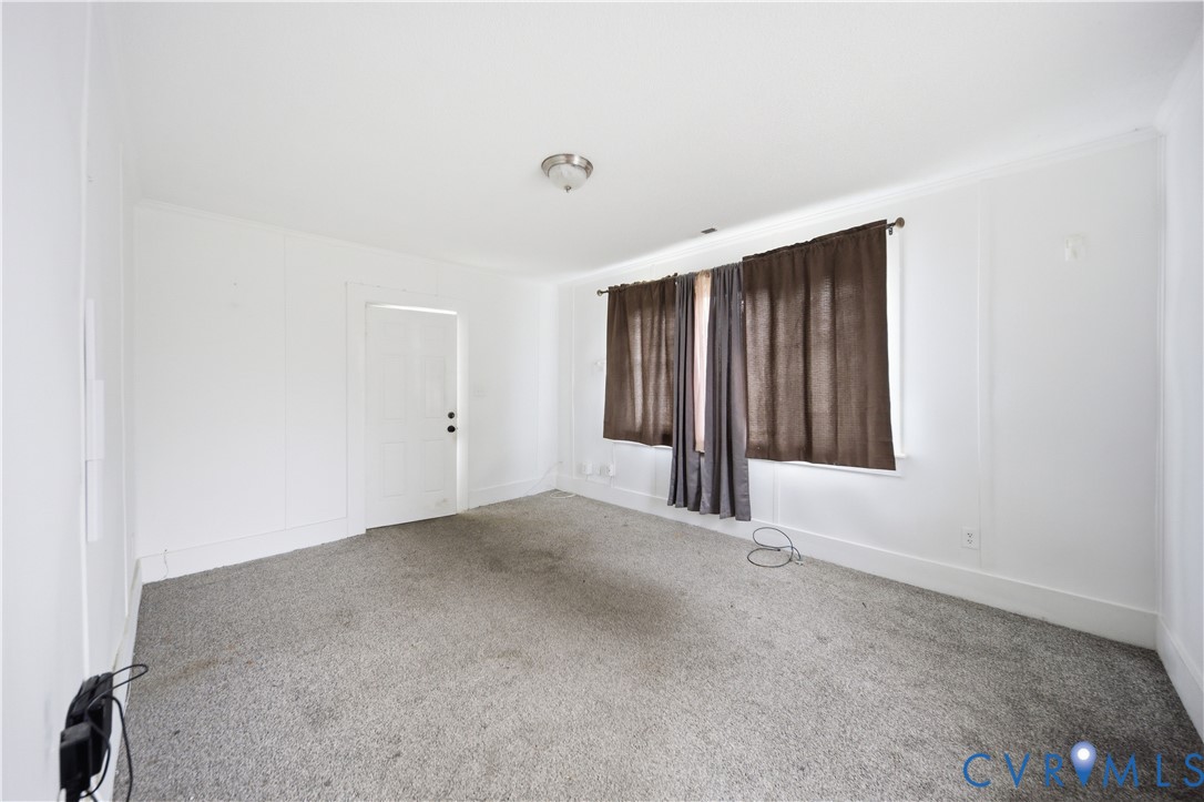 27 Bacon Street Hampton, VA 23669 - Photo 9 of 18 Empty room with carpet floors and baseboards