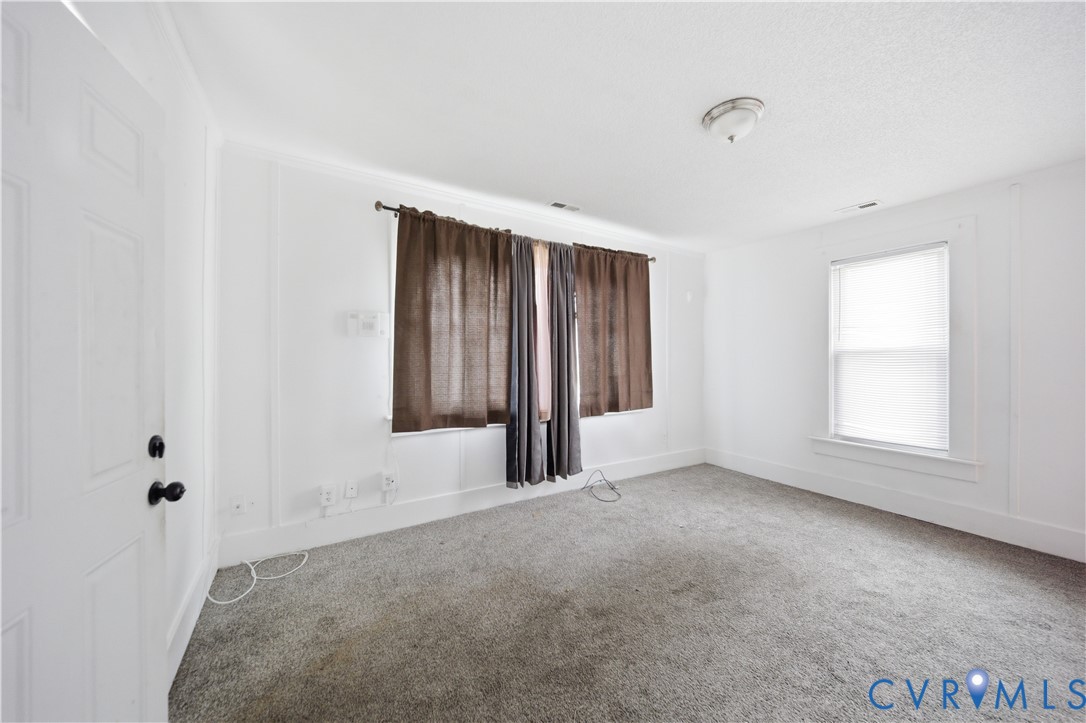 27 Bacon Street Hampton, VA 23669 - Photo 10 of 18 Carpeted empty room featuring baseboards