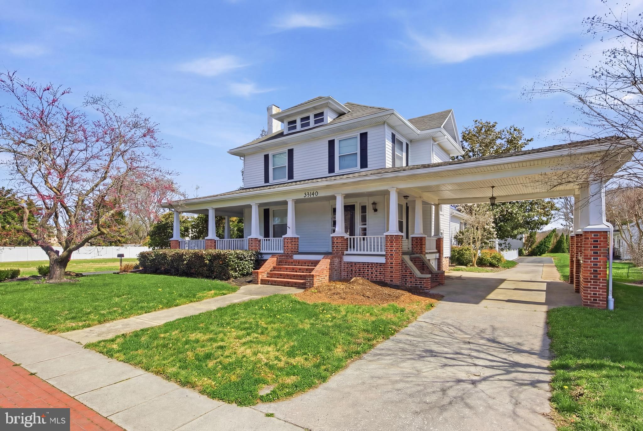 33140 Main Street Dagsboro, DE 19939 - Photo 1 of 39 a front view of a house with garden and porch