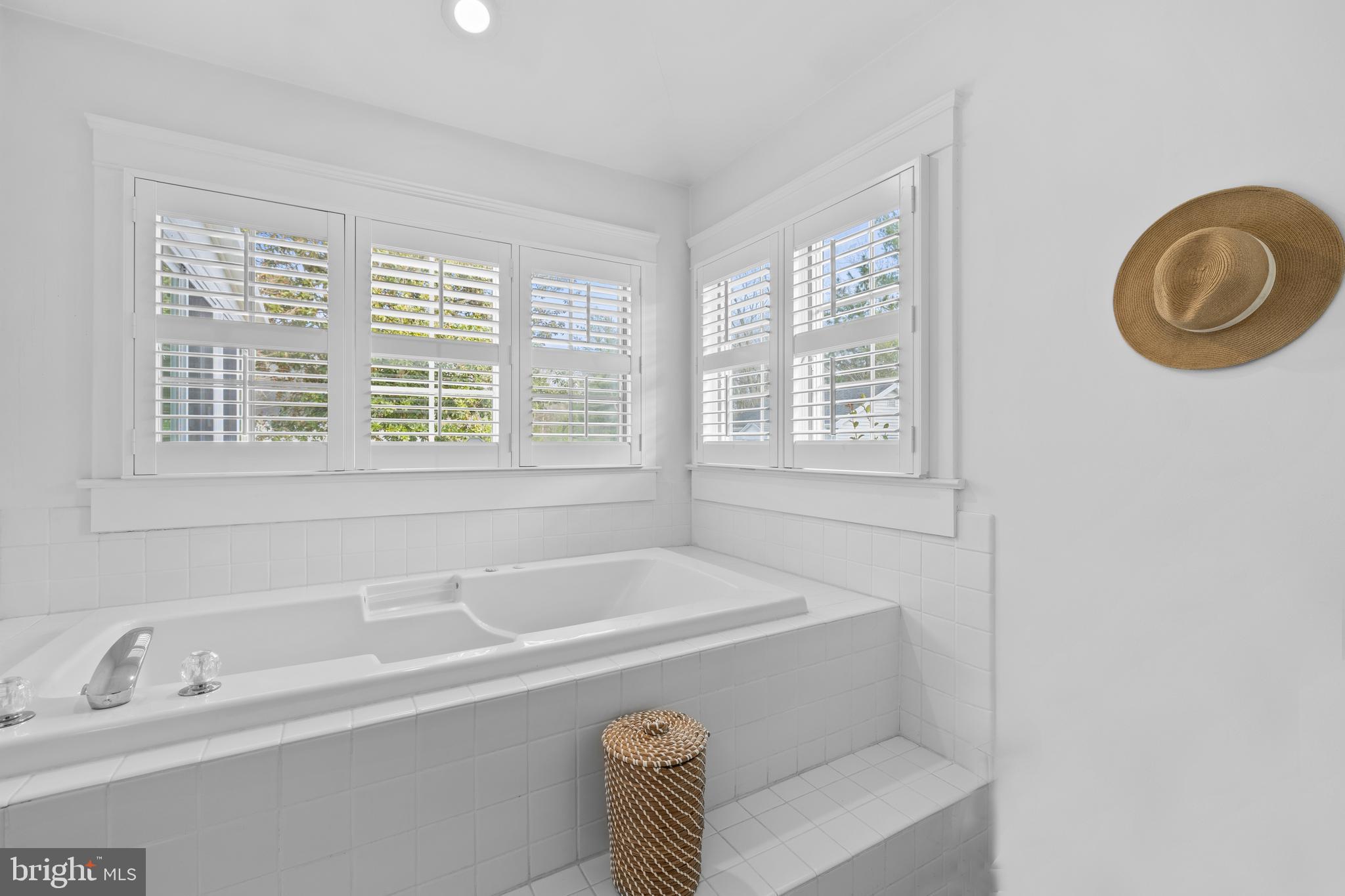 33140 Main Street Dagsboro, DE 19939 - Photo 22 of 39 a bathroom with a tub a sink and a window