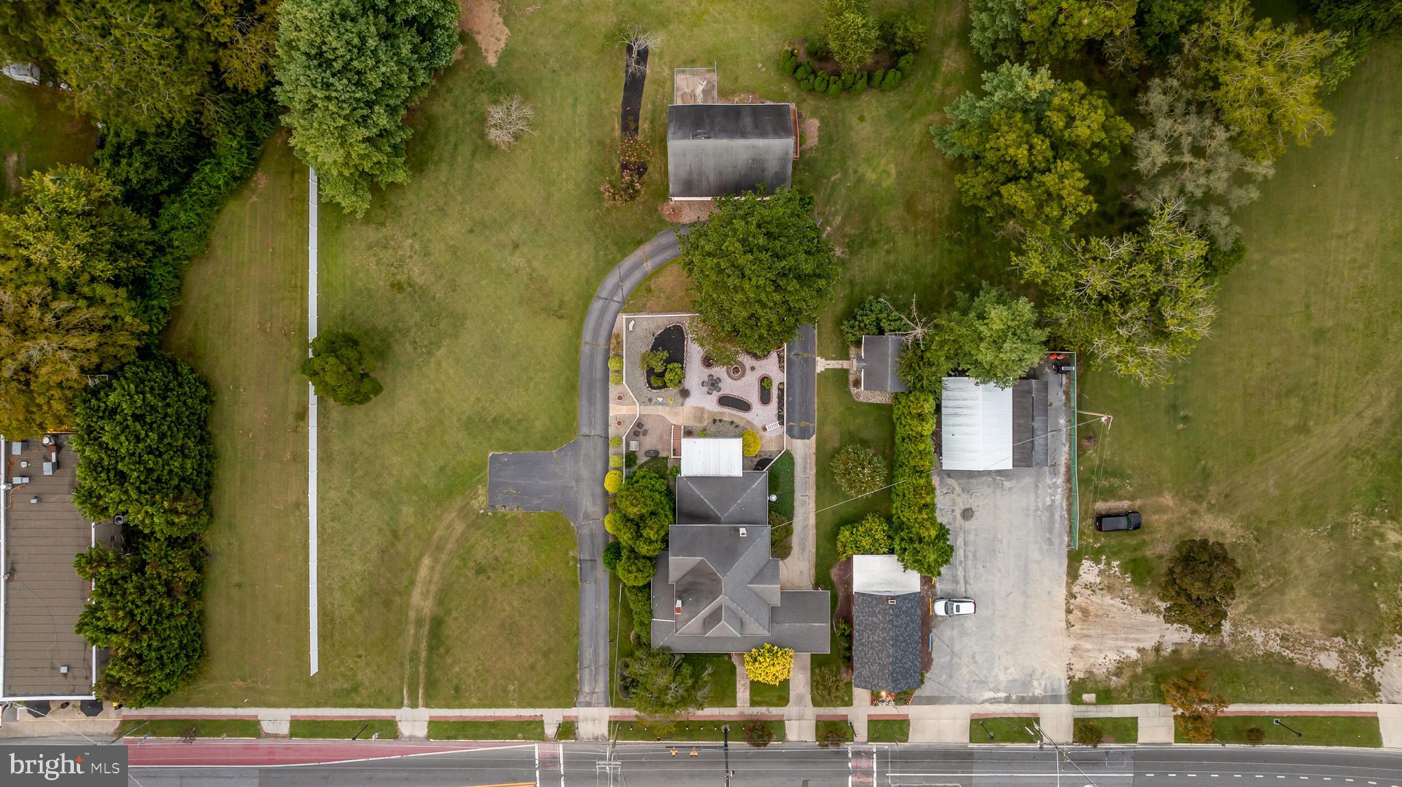33140 Main Street Dagsboro, DE 19939 - Photo 30 of 39 an aerial view of waterside residential houses with outdoor space and parking