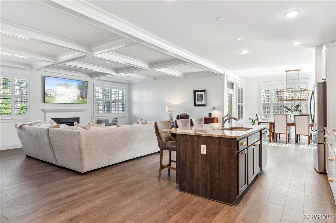 7207 Maple Summit Lane Moseley, VA 23120 - Photo 13 of 43 a living room with furniture a wooden floor and a large window