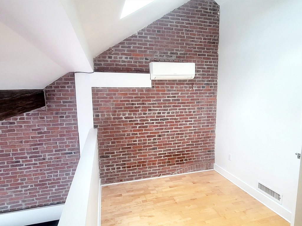 42 8th Street, Unit 2515 Boston, MA 02129 - Photo 20 of 29 a view of wooden door